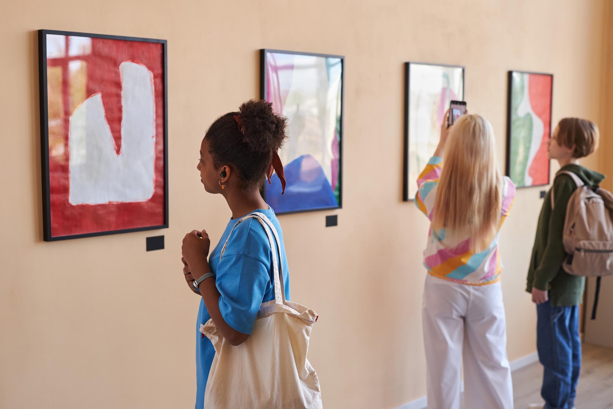 People looking at artwork at art gallery